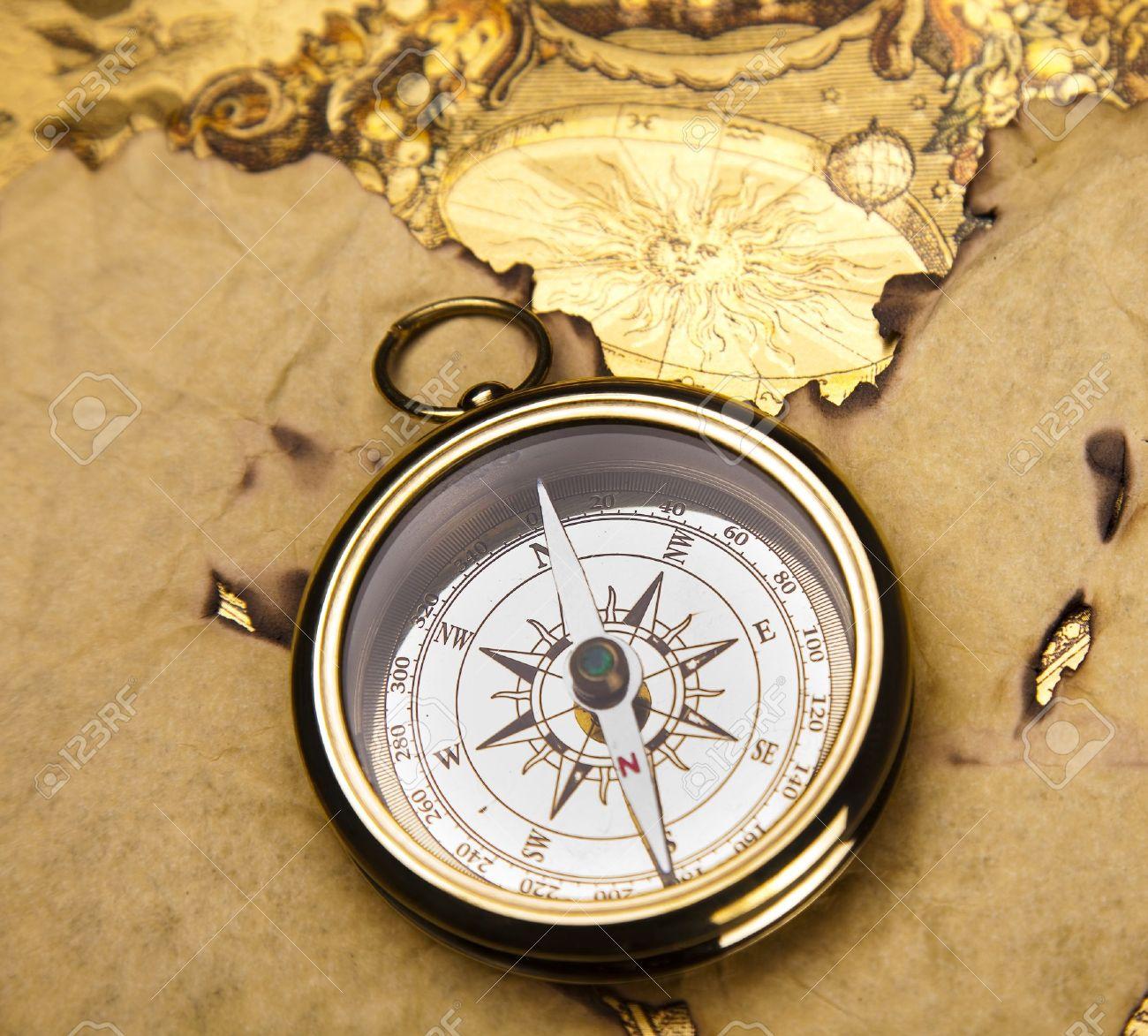 13503130-old-style-compass-and-paper-background