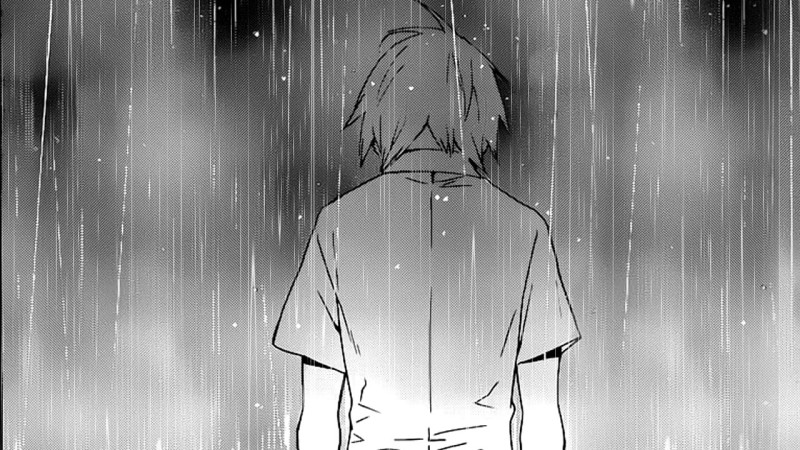 con trai buồn dưới mưa